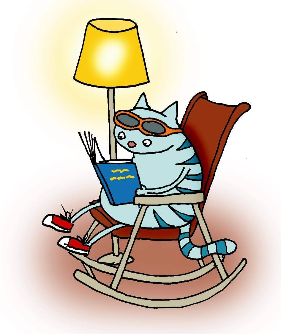 Kass loeb lambi valgel raamatut