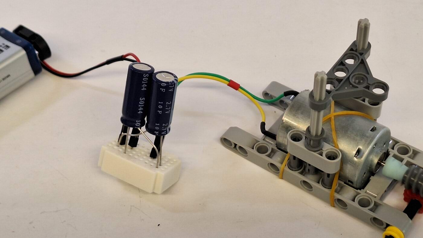 How can supercapacitors be charged with a battery